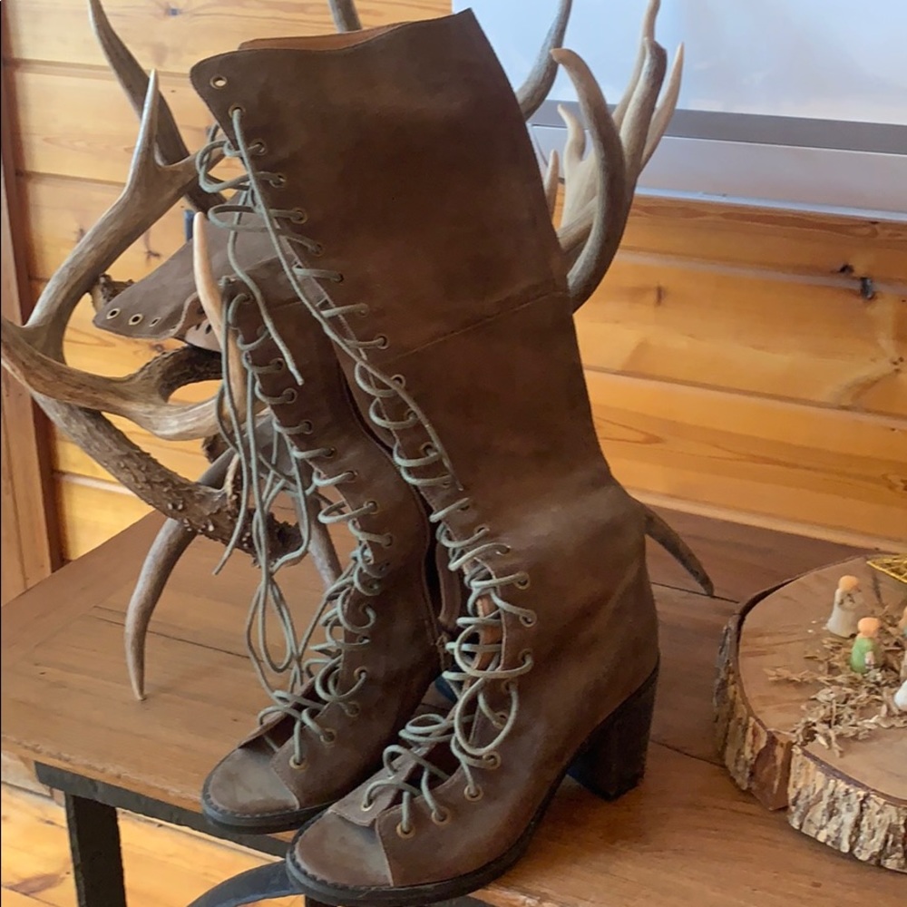 Taupe Suede lace up high boot.